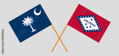 Crossed flags of The State of South Carolina and The State of Arkansas. Official colors. Correct proportion