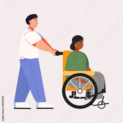 Women with disability uses a wheelchair. Man helps to use wheelchair.  Biracial family walking.