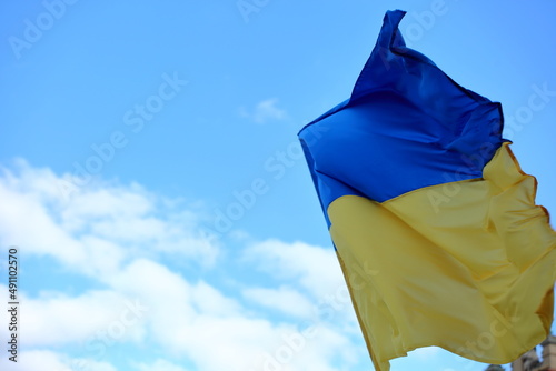 National flagt of Ukraine against blue sky