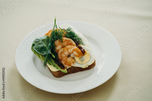 sandwich with shrimp, cucumber, egg and herbs