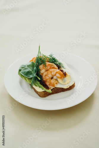 sandwich with shrimp, cucumber, egg and herbs