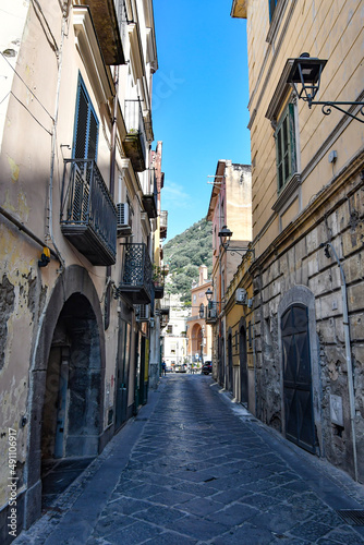 Fototapeta Naklejka Na Ścianę i Meble -  A narrow street among the old stone houses of Sarno, town in Naples province, Italy.