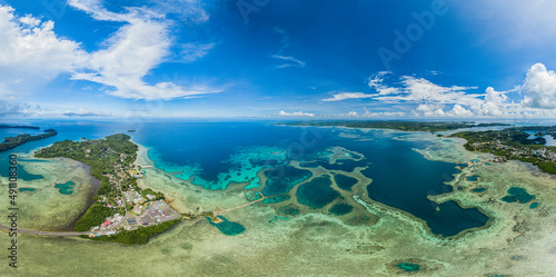 High wide angle aerial panorama of islands and coral reefs of Palau  Micronesia  Pacific Island.