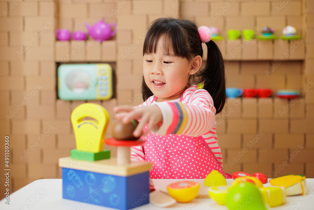 young girl pretend playing food preparing at home young girl pretend playing food preparing at home