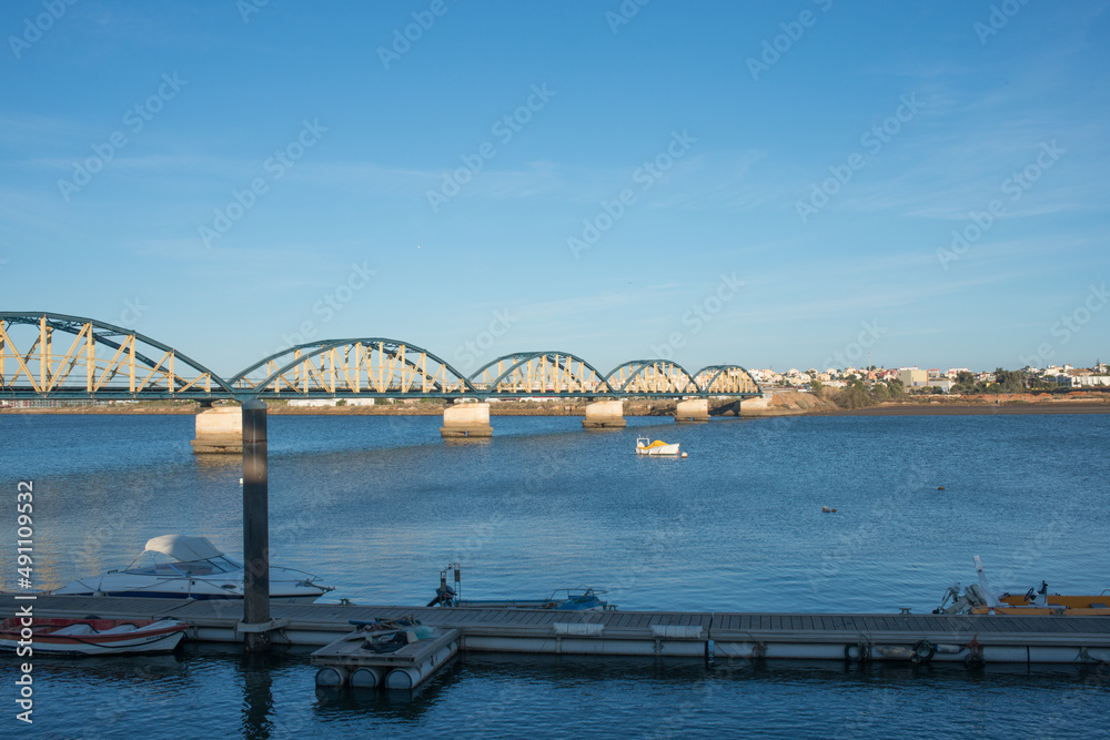 Panoramic view of old iron bridge at Portimao. Sunny day, Algarve, Portugal.