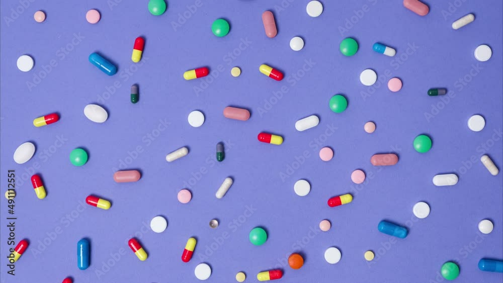 Background with moving pills. Stop motion 4K resolution medical video Background with moving pills. Stop motion 4K resolution medical video