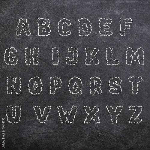 Alphabet on blackboard school classroom chalk letters english  photo