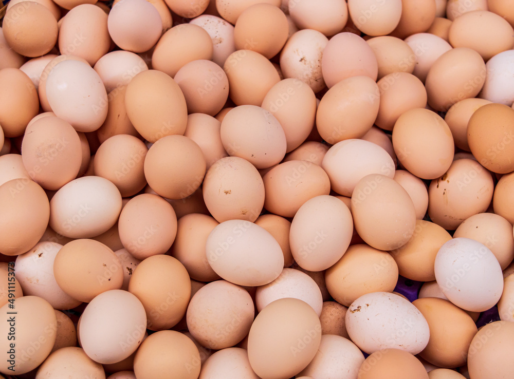 Background of fresh eggs for sale at a market.
