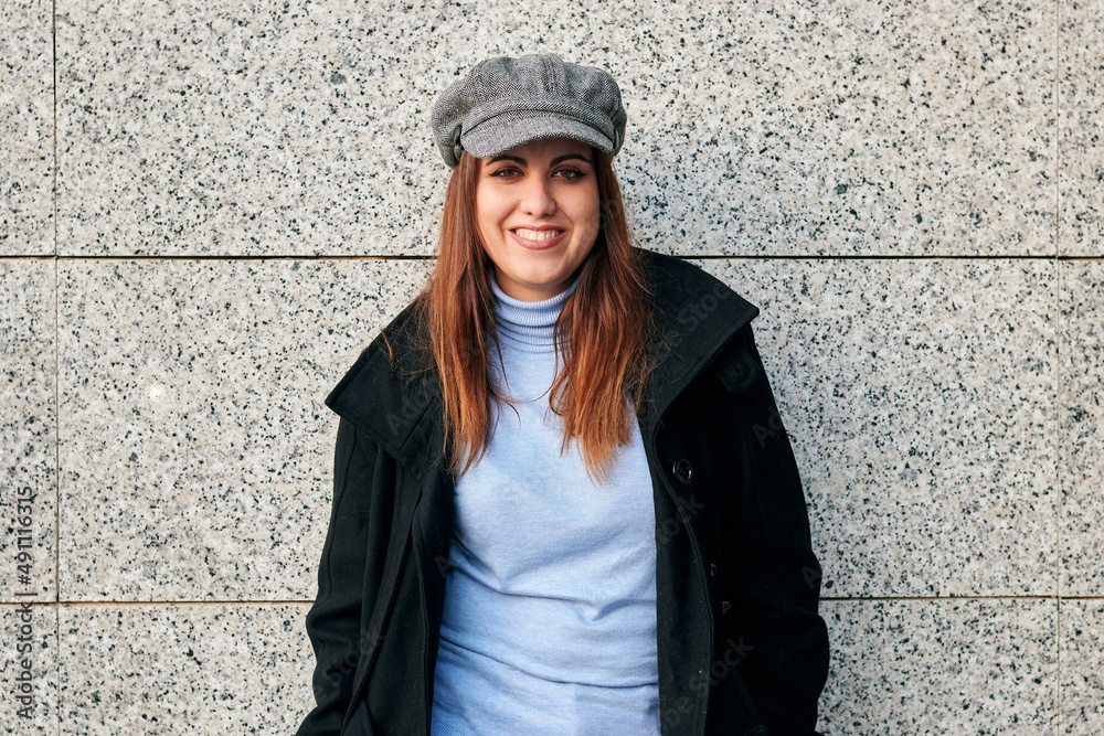 Portrait of a woman in casual clothes looking at camera on the street Portrait of a woman in casual clothes looking at camera on the street