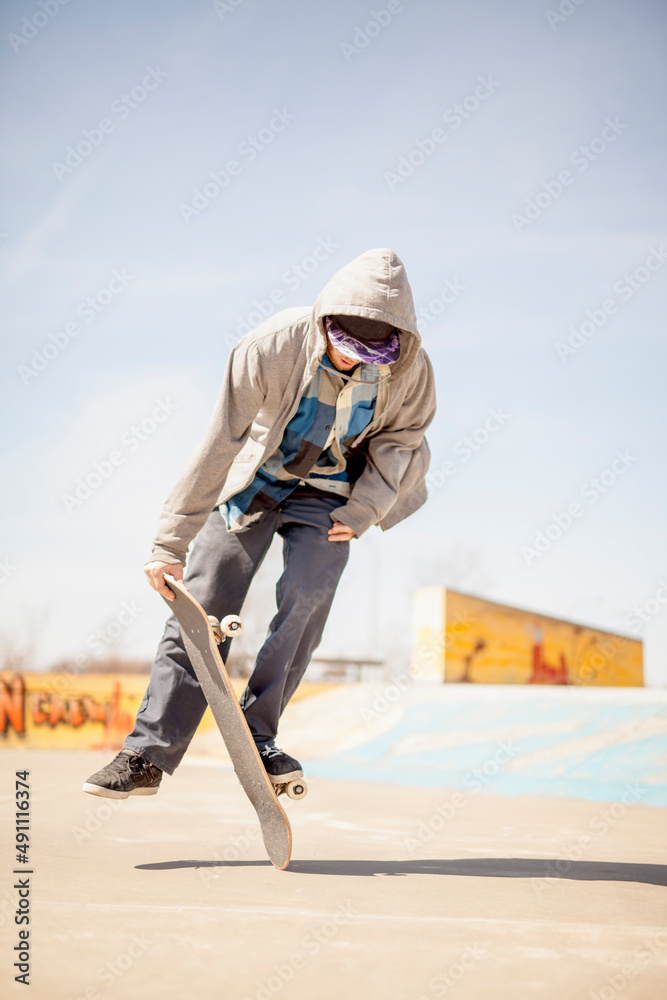 Young skateboard enthusiast doing old school tricks Young skateboard enthusiast doing old school tricks
