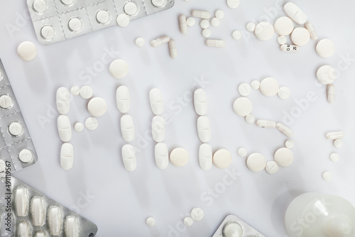 Many different pills and medical capsules close up. High quality photo