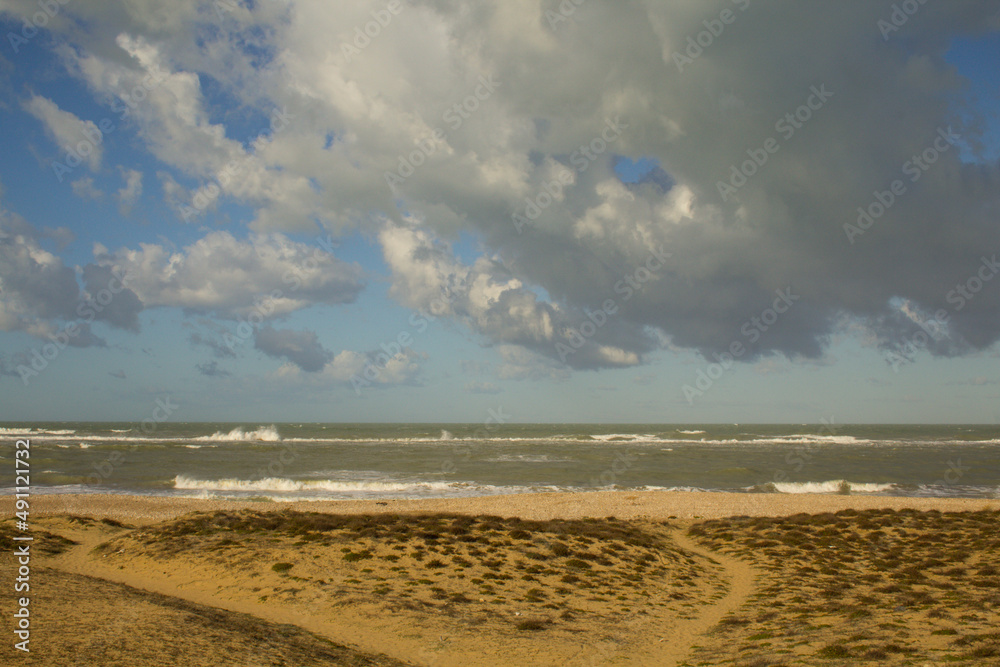 Beach in winter with rough sea and sky with clouds in Abruzzo Italy. Adriatic sea Beach in winter with rough sea and sky with clouds in Abruzzo Italy. Adriatic sea