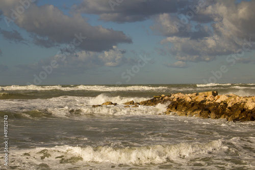 Fototapeta Naklejka Na Ścianę i Meble -  Photo from the cliff in winter with rough sea and sky with clouds in Abruzzo Italy. Adriatic Sea