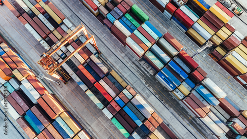 Aerial view of shipping container port terminal. Colourful pattern of containers in harbor. Maritime logistics global inport export trade transportation. photo