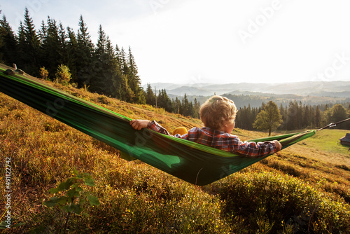 .Boy hiker resting in the mountains in autumn
