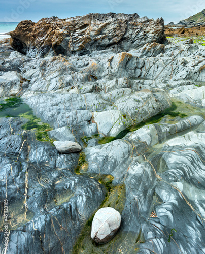 Artistic abstract smooth rock surfaces at Dollar Cove,Gunwalloe, Helston,Cornwall,England,UK. photo