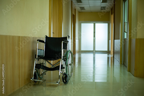 Single wheelchairs stop on foot path in front of ICU room photo