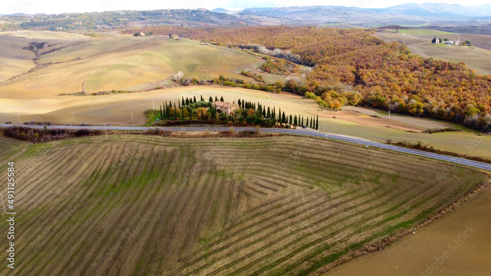 Colorful Tuscany in Italy - the typical landscape and rural fields from above - travel photography