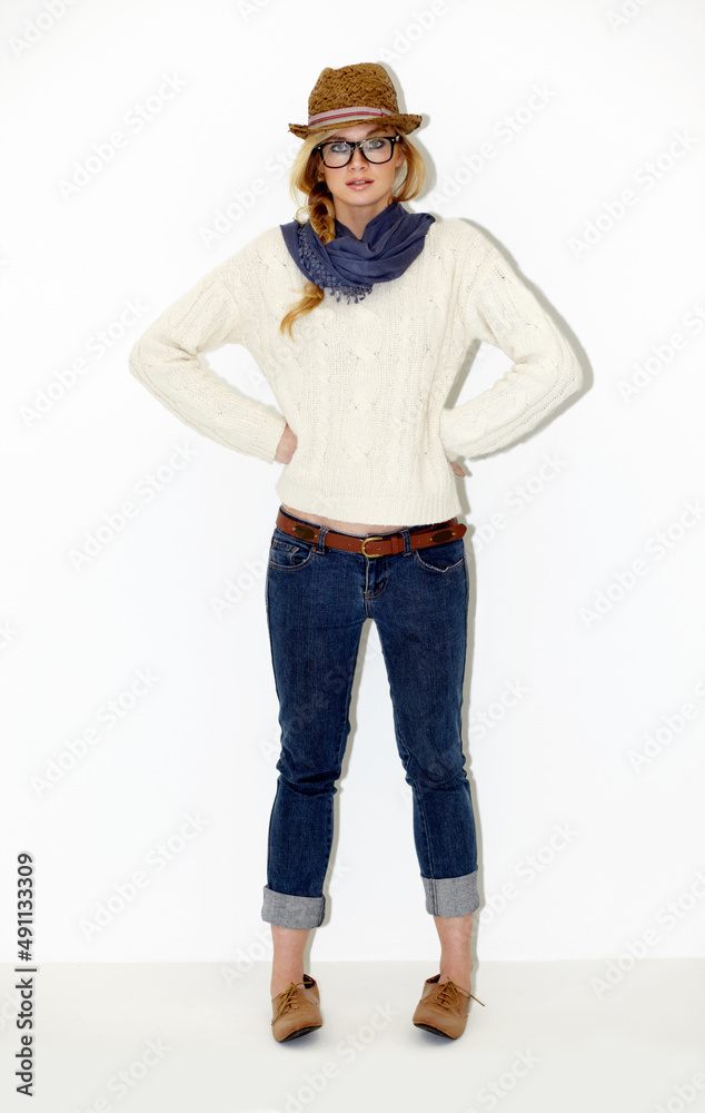 Casually waiting for her friends to arrive. Full length portrait of a stunning young woman with her hands on her hips. Casually waiting for her friends to arrive. Full length portrait of a stunning young woman with her hands on her hips.