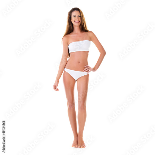 Perfect in every way. Studio portrait of a beautiful young brunette woman in a white bikini isolated on white.