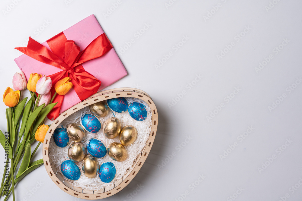 Happy easter time. Bright Easter holiday concept with spring flowers and easter eggs. Colorful Easter eggs background Happy easter time. Bright Easter holiday concept with spring flowers and easter eggs. Colorful Easter eggs background