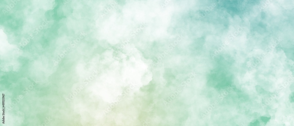 抽象背景横長バナー）緑のグラデーションの空に雲　幻想的　テンプレート　カラフル　イースター