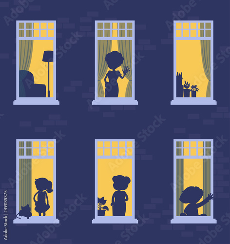 Night windows building with people silhouettes