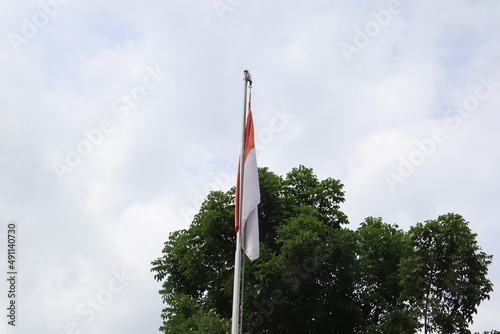 Indonesia national flag with blue sky background