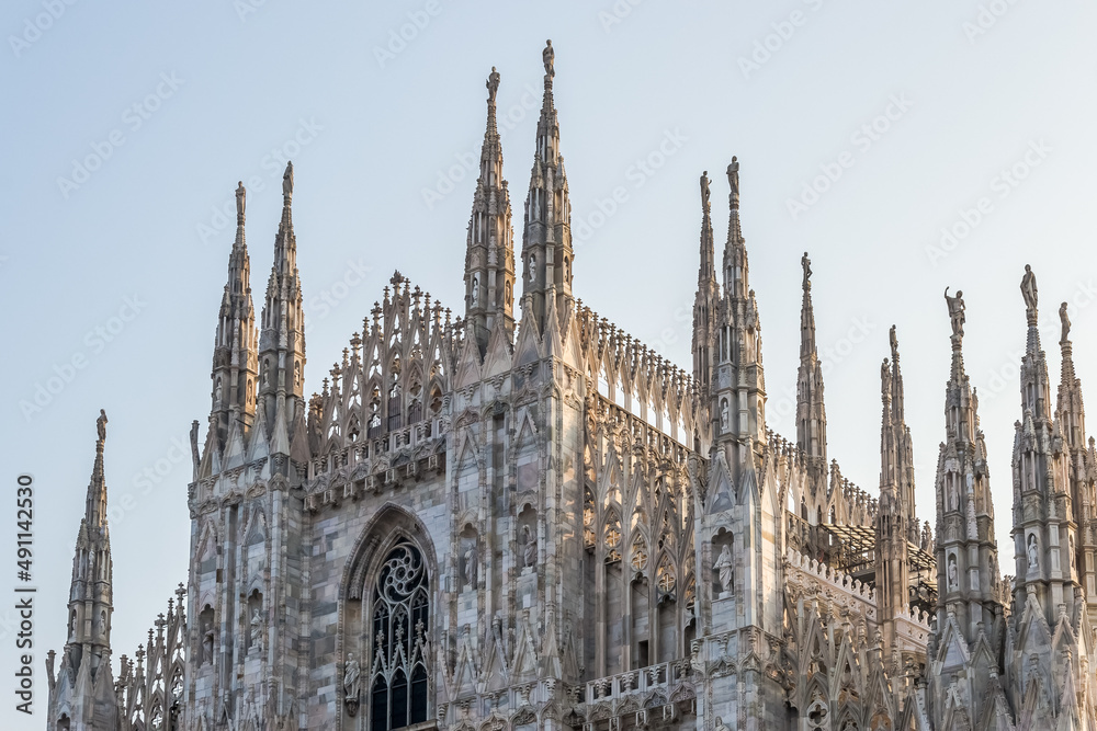 Architectural detail of The Milan Cathedral (Italian, Duomo di Milano), the cathedral church of Milan in Lombardy, Italy. Dedicated to the Nativity of St Mary it is the seat of the Archbishop of Milan Architectural detail of The Milan Cathedral (Italian, Duomo di Milano), the cathedral church of Milan in Lombardy, Italy. Dedicated to the Nativity of St Mary it is the seat of the Archbishop of Milan
