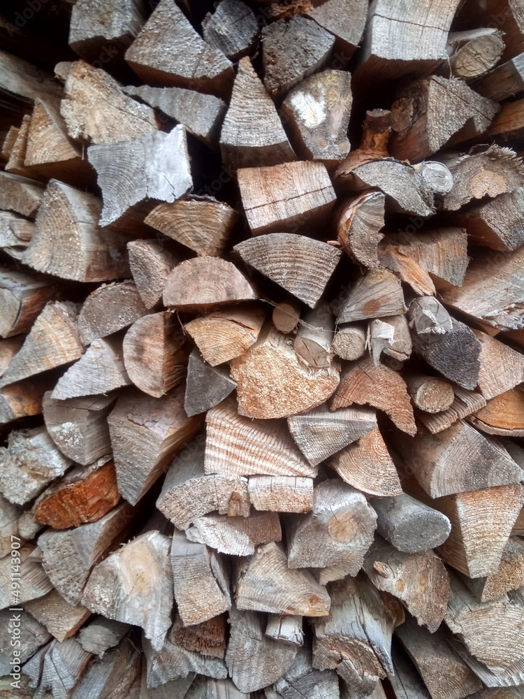 Birch firewood put in woodpile background Birch firewood put in woodpile background