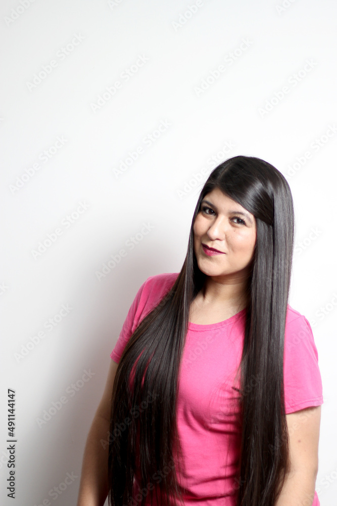 Latin adult woman poses for the camera showing her long straight black hair, healthy, shiny and silky hair looks happy and excited an overweight model body positive
Latin adult woman poses for the camera showing her long straight black hair, healthy, shiny and silky hair looks happy and excited an overweight model body positive
