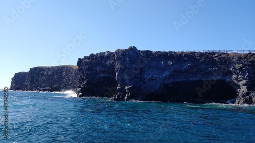 A cave along the coast in an interesting shape.