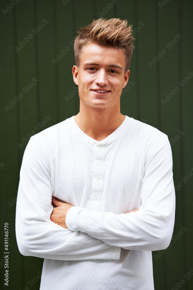 Keep calm and be a gentlemen. Portrait of a handsome young man standing outside.