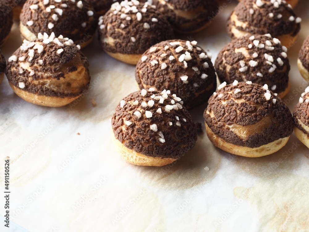 Choux pastry with chocolate cracked cookie crumble crust and sugar nib
