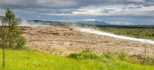 Geysir spring with steam in iceland  natural hot spring area