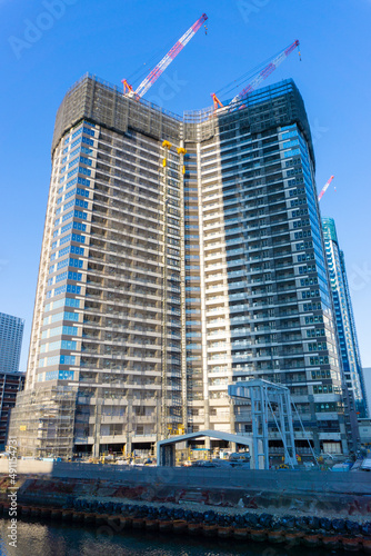 Tower condominium under construction and large crane_10