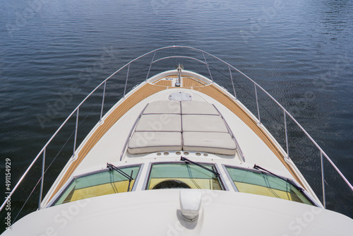 Close-up of the bow of the modern yacht driving in the sea
