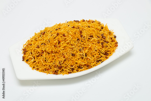 Diet Dal Bijli or Dal moth in a white ceramic bowl made with roasted Masoor Dal