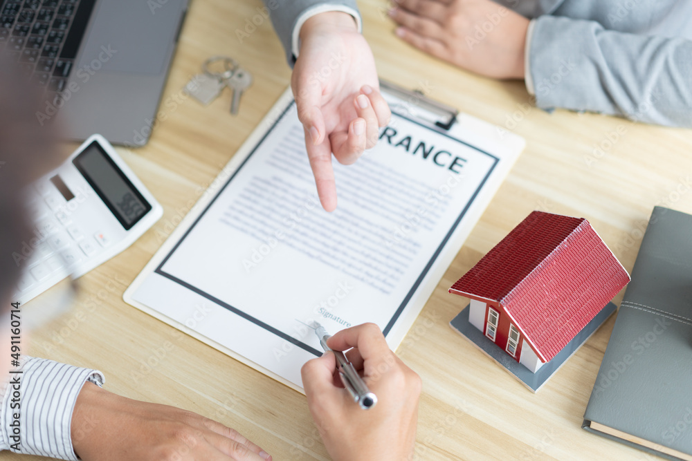 Insurance concept the broker explaining the agreement of the contract to his customer