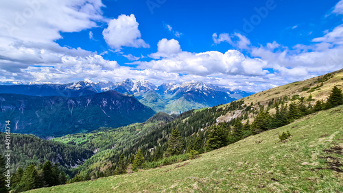 Panoramic view from Frauenkogel on mountain peaks in the Karawanks and Julian Alps, Carinthia, Austria. Borders Austria, Slovenia, Italy. Triglav National Park. Alpine meadows in spring. Woodland © Chris