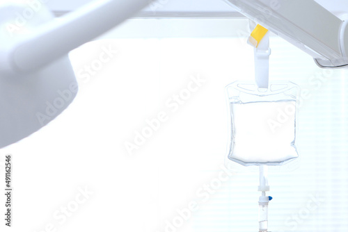 A device for slow drug administration. A dropper with medicine. Preparation for dental surgery. Medical equipment. White background.Copy space.