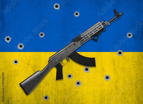 ukraine war flagg guns bullet holes photo