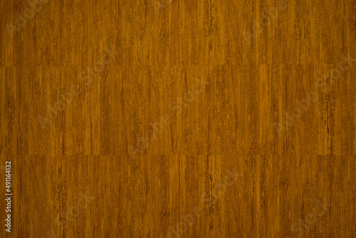 Smooth brown wood texture background from natural wood chips. The wood has a beautiful pattern for the background.