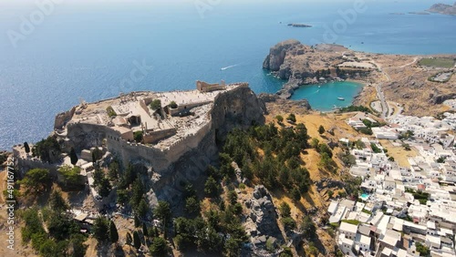 Lindos small whitewashed village and the Acropolis, scenery of Rhodos Island at Aegean Sea