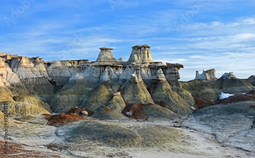 the colorful,  eroded  hoodoo rock formations in the hunter wash section of the bisti badlands on a sunny winter day, near farmington, new mexico photo