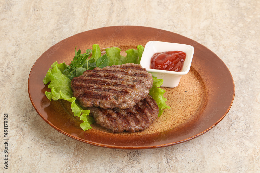 Grilled beef burger cutlet with sauce