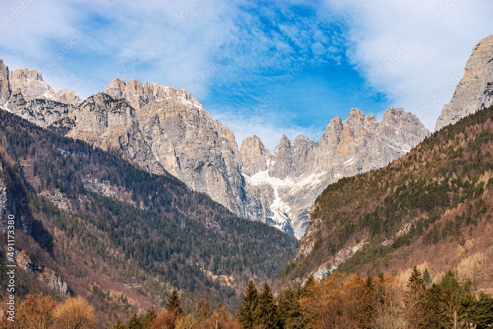 Mountain range and peak of Brenta Dolomites, National Park of Adamello Brenta view from Molveno lake in winter. UNESCO world heritage site, Trentino Alto Adige, Trento province, Italy, Europe.