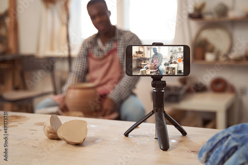 African American potter working in his studio photo