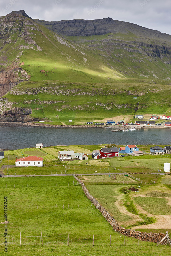 Obraz premium Picturesque Faroe islands landscape and coastline village, Famjin. Suduroy