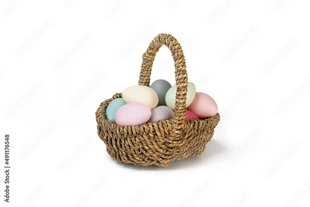 Easter Egg Basket with multicolored Eggs isolated on a white background. Easter eggs pastel colours.